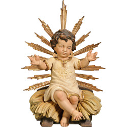Niño Jesús vestido IHS sentado en cuna con aureola